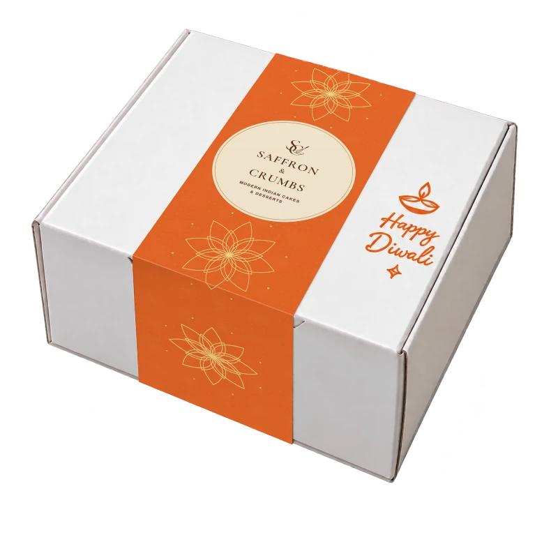 White Diwali gift box with saffron-orange packaging